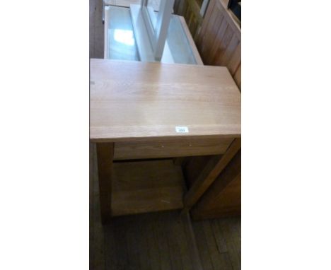 A contemporary light oak kitchen side table with a single frieze drawer and pot board.