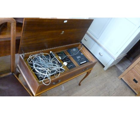 A vintage Dinatron music centre in the form of side table complete with speakers