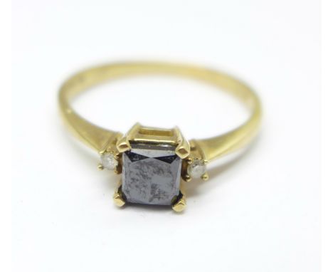 A 9ct gold, diamond and black stone ring, 2.2g, R 