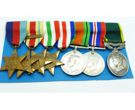 A group of seven George VI medals, the Territorial Medal named to T87531 Dvr. R.H. Sorensen, RASC, the WWII medals include th