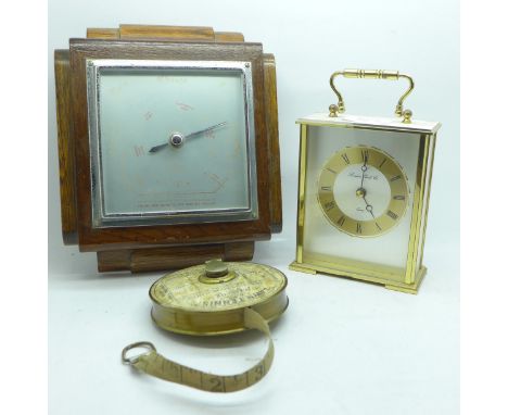 A lawn tennis measuring tape, an oak barometer and a clock 