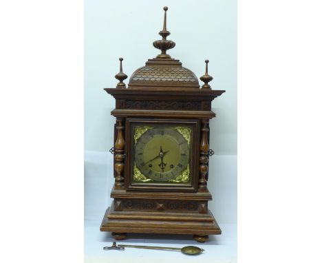 A Victorian carved oak Black Forest bracket clock, marked W &amp; H, Sch., Winterhalder &amp; Hofmeier, Schwaerzenbach, Black