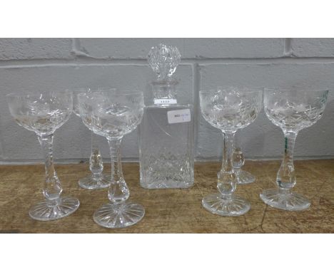 A glass decanter with six matching cut and etched wine glasses **PLEASE NOTE THIS LOT IS NOT ELIGIBLE FOR POSTING AND PACKING