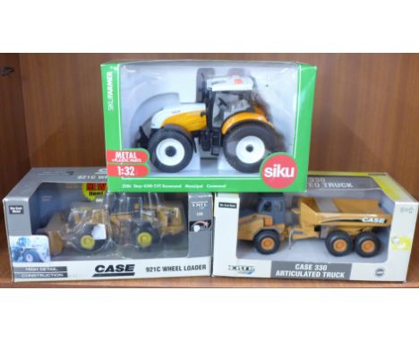Three die-cast vehicles, two Ertl and a Siku tractor 