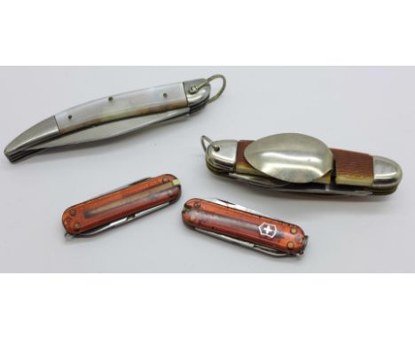 Two Victorinox knives, a multi-tool camping knife marked Ireland and one other, (4) 