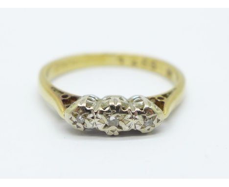 An 18ct gold, platinum set three stone diamond ring, 2.3g, K 