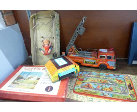 A Japanese Kokyu tin-plate fire engine, a Branko Mechanical Acrobat, a tin-plate 'Auto' matic garage and two cars, Lott's Bri