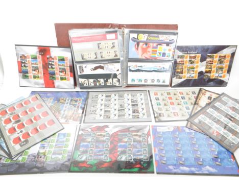 Royal Mail - A large collection of British Royal Mail commemorative stamps presentation packs held within a Royal Mail stamp 