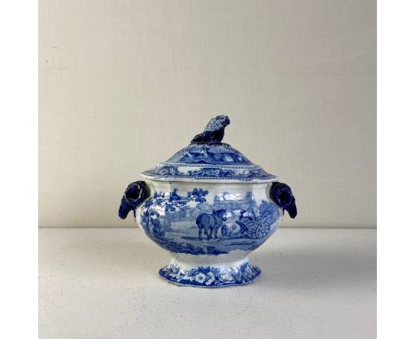 An early 19th century blue and white Rural Scenery pattern sauce tureen by John and William Ridgway having a hand painted cob