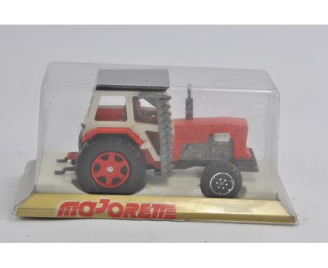 Majorette Tractor and Cutter Bar. M in Box.