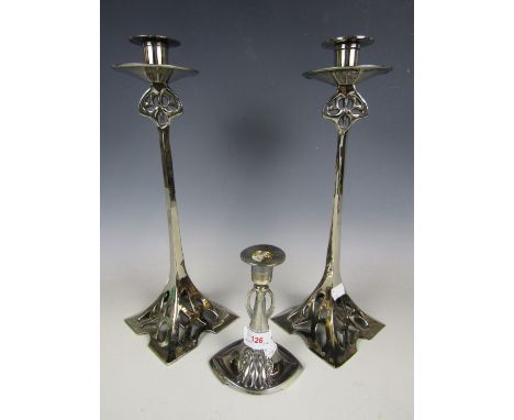 A WMF candlestick together with a pair of contemporary electroplate candlesticks