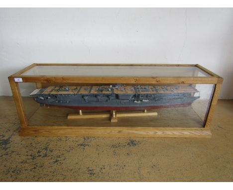 A large hand-built wooden scale model of an Imperial Japanese Navy aircraft carrier, in high quality bespoke glazed oak case,