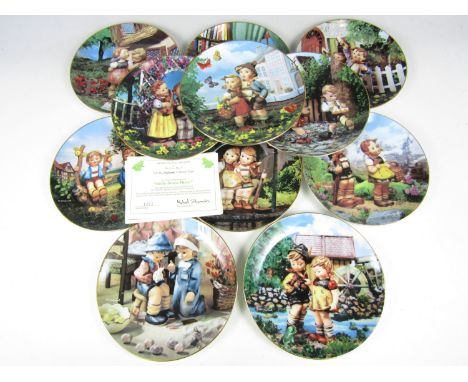 Eleven Hummel collectors' plates