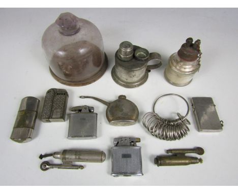 Sundry collectors' items including a watchmaker’s glass dome, a ring gauge and lighters including a trench art example etc.