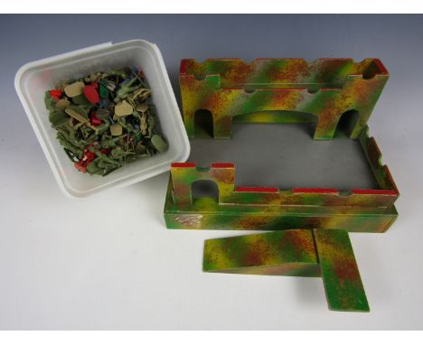 A vintage model fort with toy soldiers 