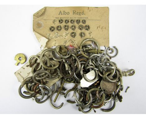 A quantity of vintage pocket watch spare bows, watch chain swivels etc