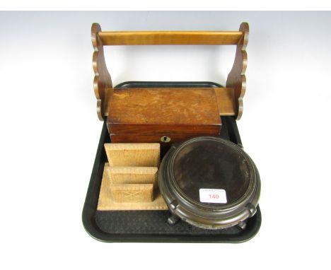 A mahogany tea caddy together with a book trough, an oak letter rack and a carved stand