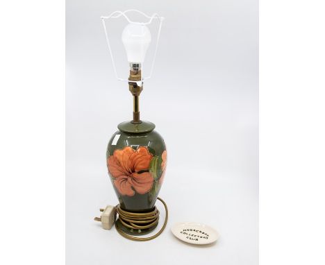 Late 20th Century green ground Moorcroft table lamp, no shade, along with Moorcroft collectors club pin dish