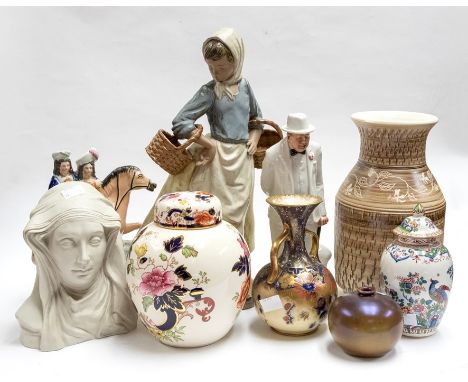 A large Nao figure, of a girl carrying baskets, approx 38cm high; a Royal Doulton figure of Sir Winston Churchill; a Stafford