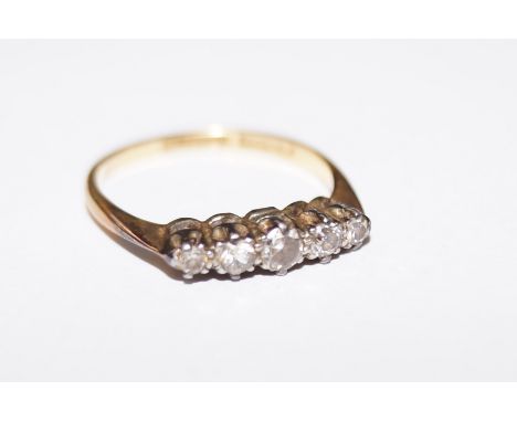 18 gold ring set with five diamonds, size M  