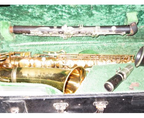 E. Auto Underslung Conn professional saxophone together with Albeck Star articulated Bohem clarinet in fitted case  