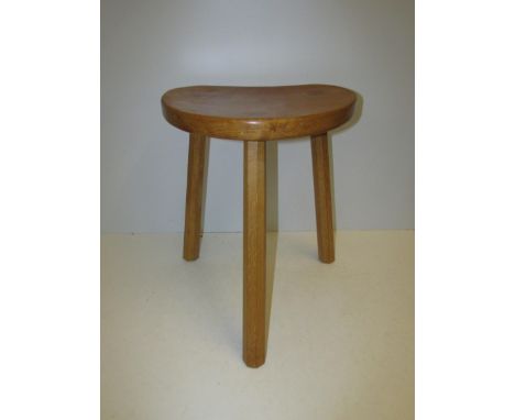 Mouseman: A Robert Thompson of Kilburn English Oak Kidney shaped Calf Stool, on three octagonal legs, with carved mouse signa