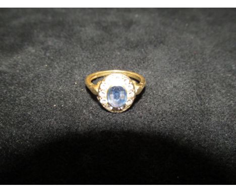 18ct Yellow Gold Ring set with good quality central sapphire surrounded by 12 cut diamonds, Size N