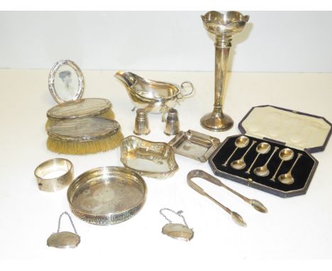 Collection of silver items to include, gravy boat, candle stick, dish, pair of brushes, pair of salts, photo frame, set of 6 