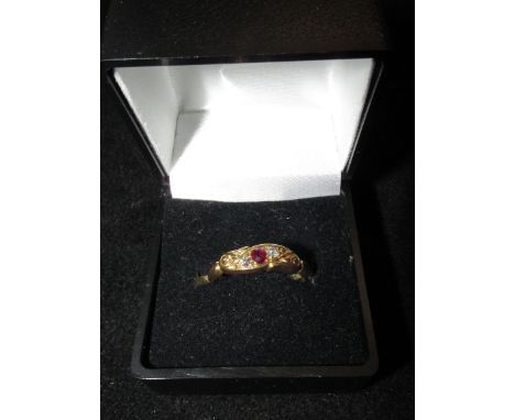 Early 20th century yellow metal ring set with diamond and ruby. Size O