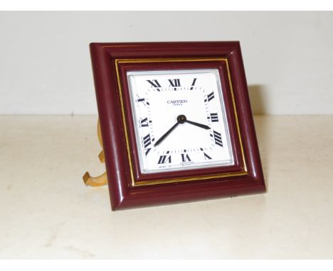 Cartier, Paris travel clock with box and papers 8 day movement numbered 7503 07067. The clock is set on the signature "C" sta