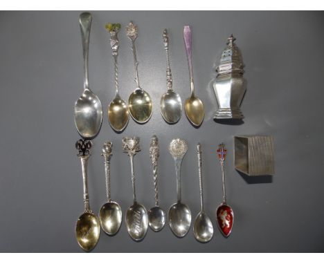 A silver pepperette,  teaspoons and a silver napkin ring.