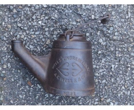 A cast iron Wells 'Unbreakable' oil lamp No.18  with cover &amp; wick, 7" high.