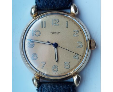 A 1950's/60's gent's 18ct gold IWC wrist watch, the gold dial with Arabic numerals, centre seconds, case diameter 36mm, on re