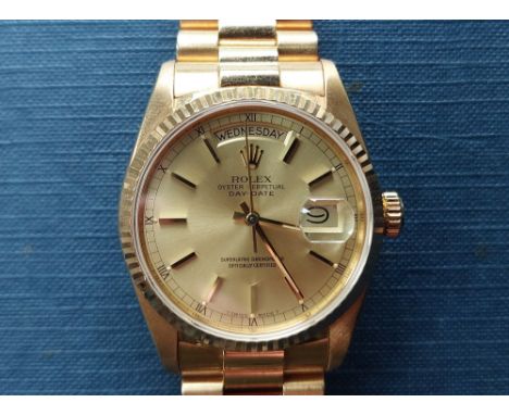 A boxed 1986/87 gent's 18ct gold Rolex Oyster Perpetual Day/Date 18038 wrist watch with gold dial, baton markers,case diamete