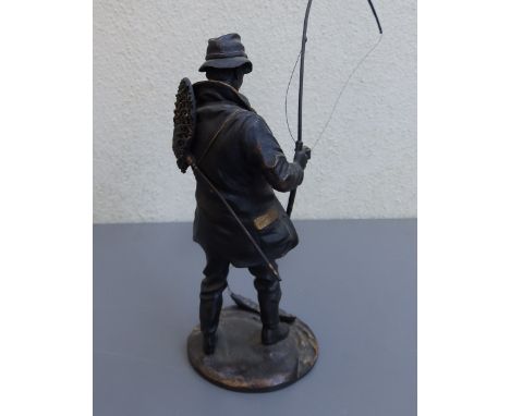 A bronze study of an angler with fishing rod - base missing, 8" high overall.