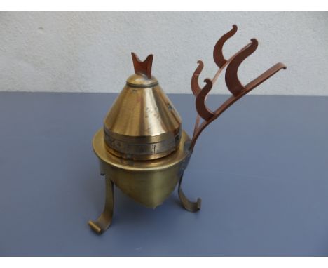 A German Dopp.Z shell fuse dated 1917, made into an inkwell supported on a shell case base with two pen holders above, , 6.25