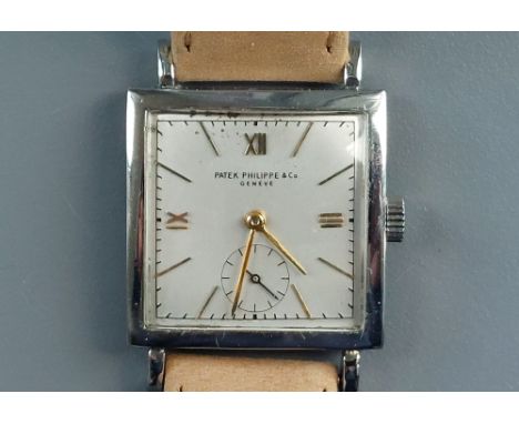 A 1947 gent's&nbsp; steel cased Patek Philippe manual wind wrist watch Ref 1431, the square silvered dial with gold hands &am