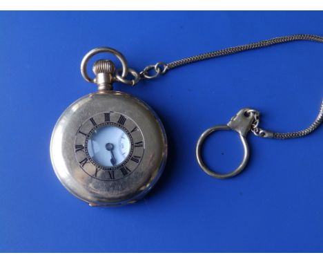 A gold plated Dennison half hunter pocket watch on 9ct. Chain.