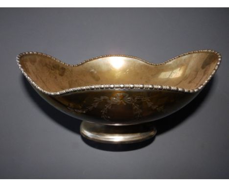 A silver pedestal fruit bowl of quatrefoil shape -  Harry Atkins, Sheffield 1913,  10.5" across.