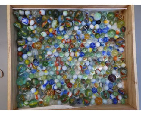 A box containing a large quantity of old and other glass marbles.