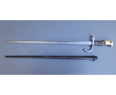 A French 'gras' bayonet with 20.5" blade in scabbard, manufactured at St. Etienne, April 1878.
