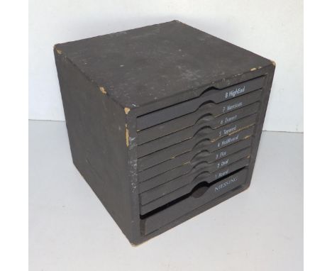 An eight-drawer Neissing display chest of specimen rings in silver with tension set diamond simulants, from 'Round' to 'High 