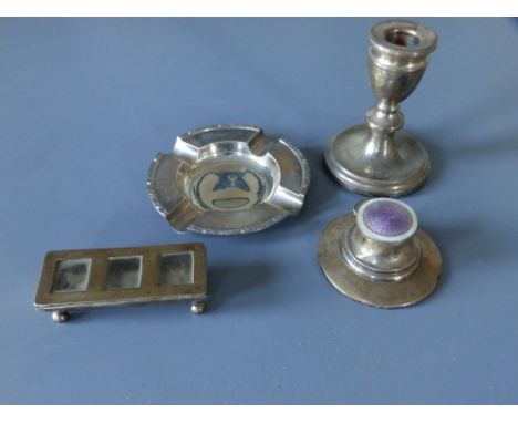 A Birmingham silver triple section stamp box, 3.5" across, a modern Birmingham ashtray, a dwarf silver candlestick and a dama