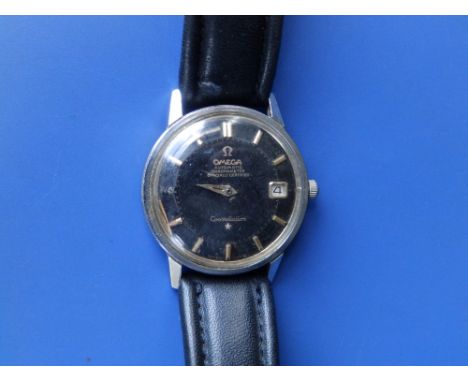 A gent's stainless steel Omega Constellation Automatic Chronometer wrist watch, the black dial with date indicator, gold bato