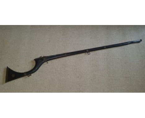 An Arab long wiith well decorated wooden stock, silver inlay to barrel, 59.5" overall.
