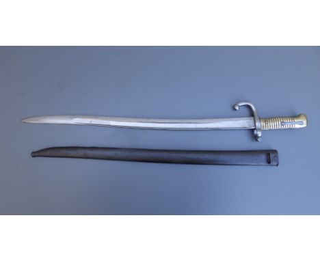 A French chassepot bayonet with 22.25" blade in scabbard, manufactured at St. Etienne, August 1868.