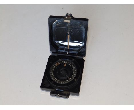 A black bakelite military compass.