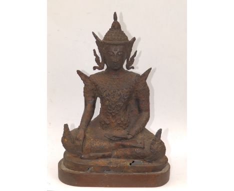 An antique Thai gilt bronze Buddha, seated in Dhyanasana, wearing elaborately decorated winged robes, 12.5" high, on later wo