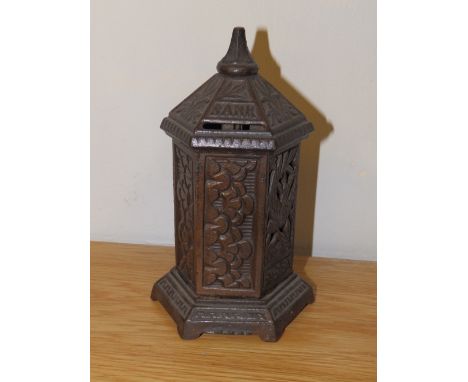 A Victorian cast iron hexagonal pillar box money bank.