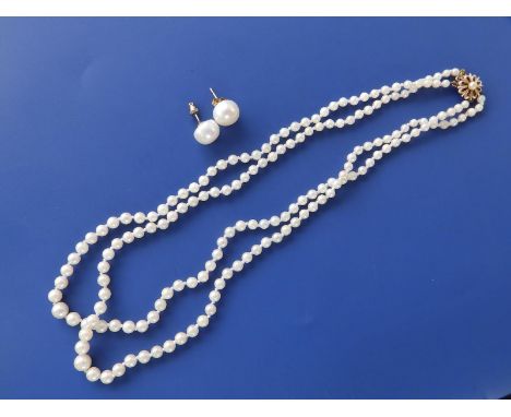 A graduated pearl twin strand necklace with yellow metal clasp and a pair of button pearl earrings, approx. 11.8mm diameter. 